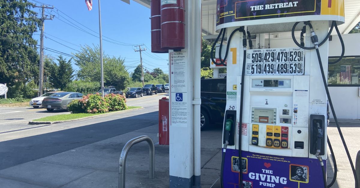 Gas station pump with The Retreat at the top.